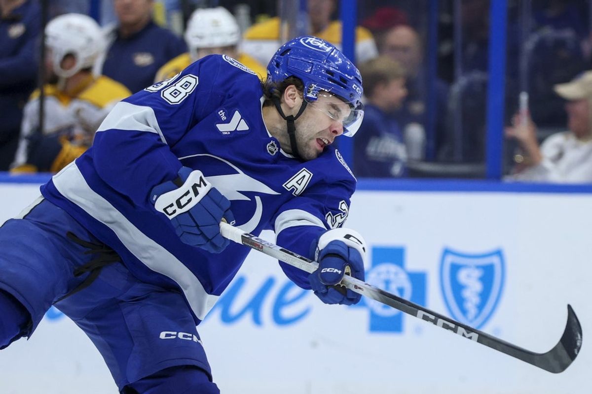 Mar 29, 2026; Tampa, Florida, USA; Tampa Bay Lightning left wing Brandon Hagel (38) shoots the puck against the Nashville Predators in the third period at Benchmark International Arena. Mandatory Credit: Nathan Ray Seebeck-Imagn Images