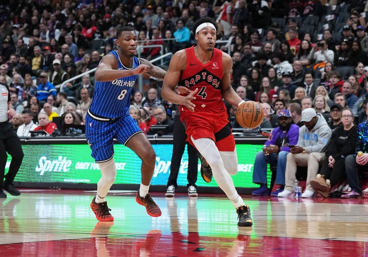 Mar 29, 2026; Toronto, Ontario, CAN; Toronto Raptors forward Scottie Barnes (4) drives to the basket as Orlando Magic forward Jamal Cain (8) tries to defend during the third quarter at Scotiabank Arena. Mandatory Credit: Nick Turchiaro-Imagn Images