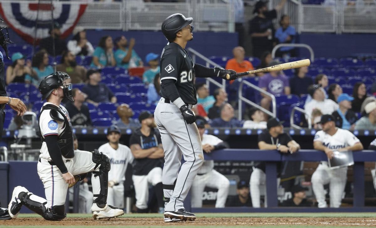 Mar 30, 2026; Miami, Florida, USA;  Miami Marlins catcher Liam Hicks (34) and Chicago White Sox first baseman Miguel Vargas (20) watch his grand slam during the fourth inning at loanDepot Park. Mandatory Credit: Rhona Wise-Imagn Images
