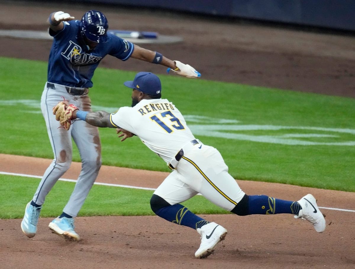 Milwaukee Brewers third baseman Luis Rengifo (13) tags Tampa Bay Rays center fielder Chandler Simpson (14) during the second inning of their game Monday, March 30, 2026 American Family Field in Milwaukee, Wisconsin.