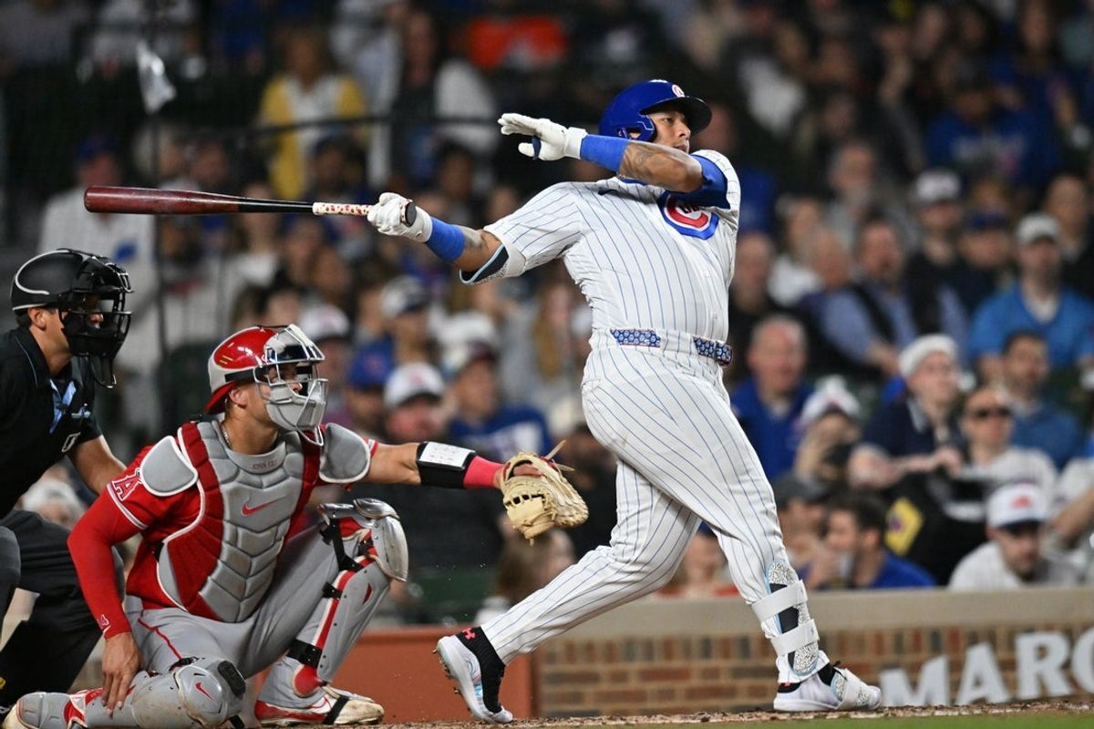 Mar 30, 2026; Chicago, Illinois, USA; Chicago Cubs designated hitter Moises Ballesteros (25) hits a two-run single against the Los Angeles Angels during the third inning at Wrigley Field. Mandatory Credit: Patrick Gorski-Imagn Images