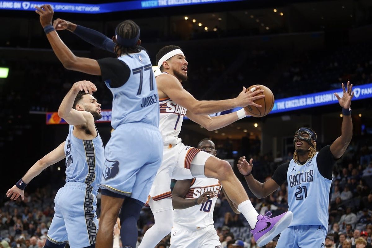 Mar 30, 2026; Memphis, Tennessee, USA; Phoenix Suns guard Devin Booker (1) drives to the basket against the Memphis Grizzlies during the second quarter at FedExForum. Mandatory Credit: Petre Thomas-Imagn Images