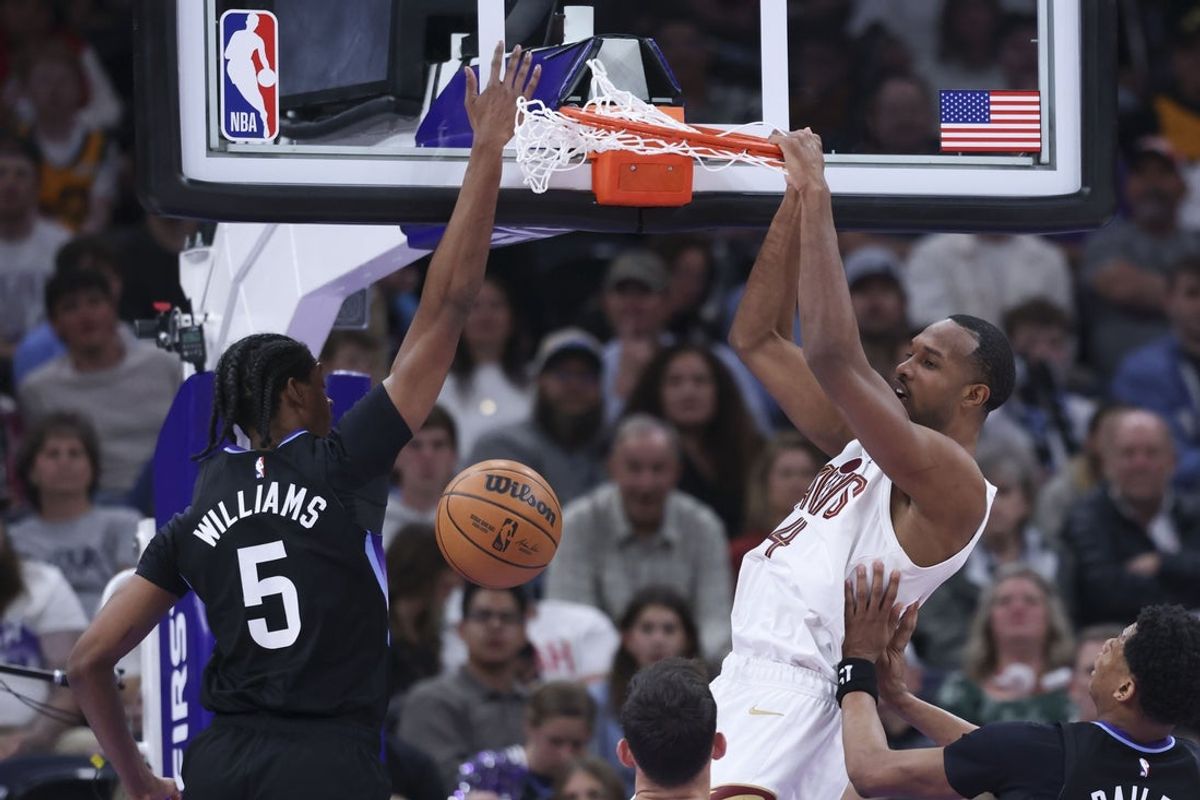 Mar 30, 2026; Salt Lake City, Utah, USA; Cleveland Cavaliers center Evan Mobley (4) dunks the ball against Utah Jazz forward Cody Williams (5) during the first half at Delta Center. Mandatory Credit: Rob Gray-Imagn Images