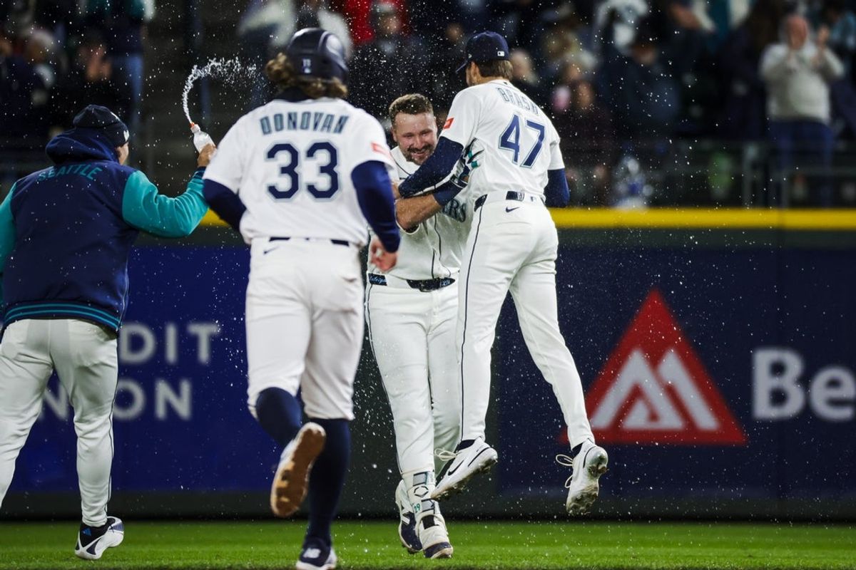 Mar 30, 2026; Seattle, Washington, USA; Seattle Mariners catcher Cal Raleigh (29, right) celebrates aith pitcher Matt Brash (47) after hitting a walk-off RBI-single against the New York Yankees during the ninth inning at T-Mobile Park. Mandatory Credit: Joe Nicholson-Imagn Images