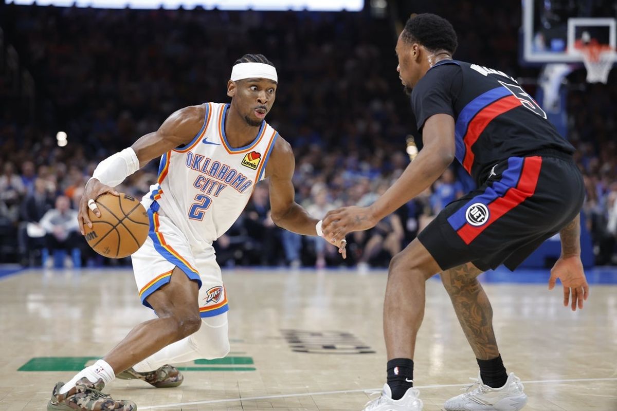 Mar 30, 2026; Oklahoma City, Oklahoma, USA; Oklahoma City Thunder guard Shai Gilgeous-Alexander (2) drives against Detroit Pistons forward Ronald Holland II (5) during the second half at Paycom Center. Mandatory Credit: Alonzo Adams-Imagn Images