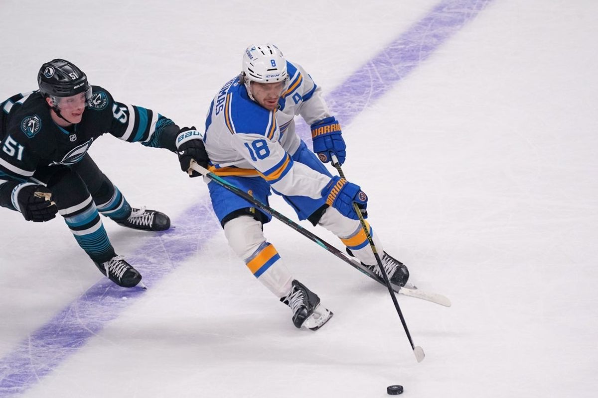 Mar 30, 2026; San Jose, California, USA;  St. Louis Blues center Robert Thomas (18) controls the puck while defended by San Jose Sharks right wing Collin Graf (51) in the third period at SAP Center at San Jose. Mandatory Credit: David Gonzales-Imagn Images