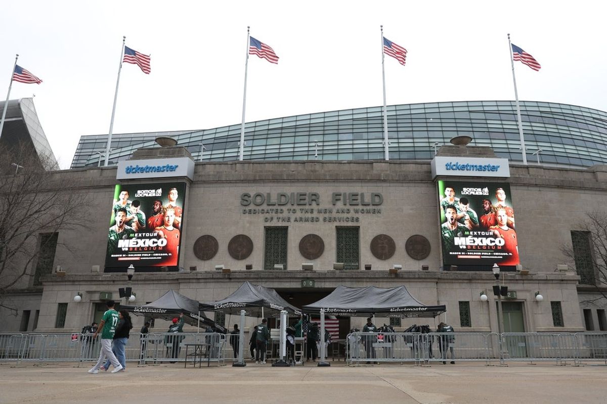Mar 31, 2026; Chicago, IL, USA; Fans walk past the entrance of Soldier Field prior to a match between Mexico and Belgium. Mandatory Credit: Talia Sprague-Imagn Images