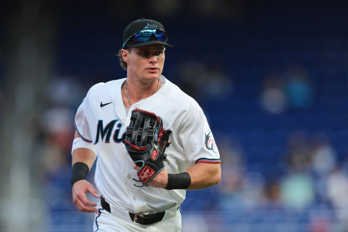 Mar 31, 2026; Miami, Florida, USA; Miami Marlins right fielder Griffin Conine (18) returns to the dugout against the Chicago White Sox during the first inning at loanDepot Park. Mandatory Credit: Sam Navarro-Imagn Images