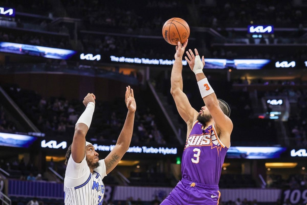 Mar 31, 2026; Orlando, Florida, USA; Phoenix Suns forward Dillon Brooks (3) shoots over Orlando Magic center Wendell Carter Jr. (34) during the first quarter at Kia Center. Mandatory Credit: Mike Watters-Imagn Images