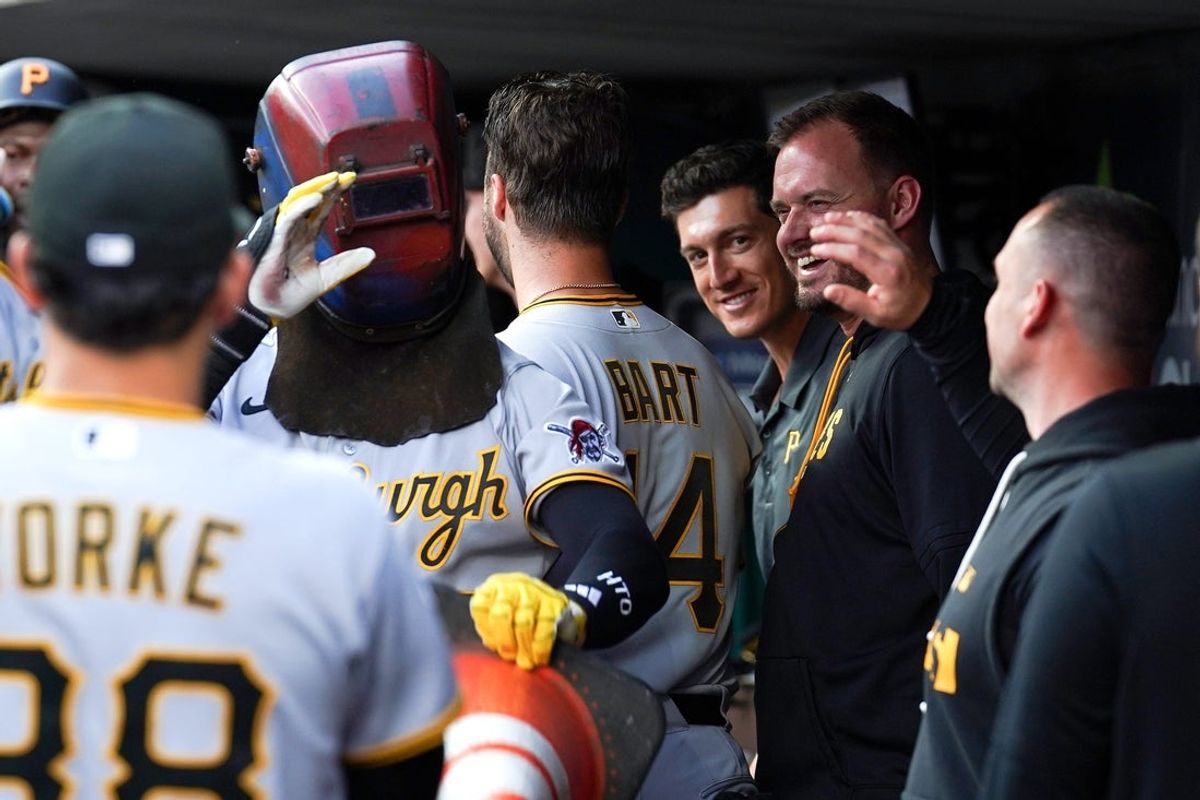 Pittsburgh Pirates first baseman Ryan O'Hearn (29) celebrates with teammates in the dugout after hitting a homer in the second inning of a MLB game between the Cincinnati Reds and Pittsburgh Pirates, Tuesday, March 31, 2026, at Great American Ball Park in downtown Cincinnati.