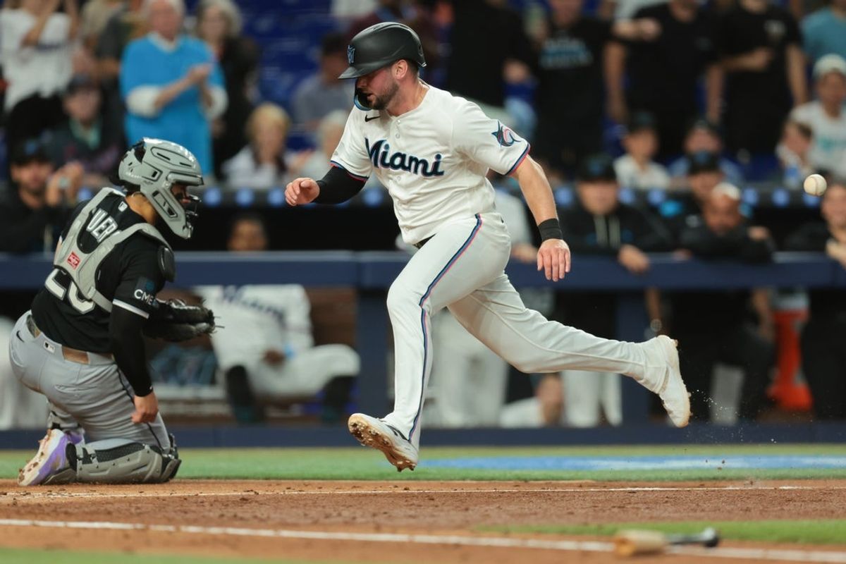 Mar 31, 2026; Miami, Florida, USA; Miami Marlins first baseman Liam Hicks (34) scores against the Chicago White Sox during the fourth inning at loanDepot Park. Mandatory Credit: Sam Navarro-Imagn Images