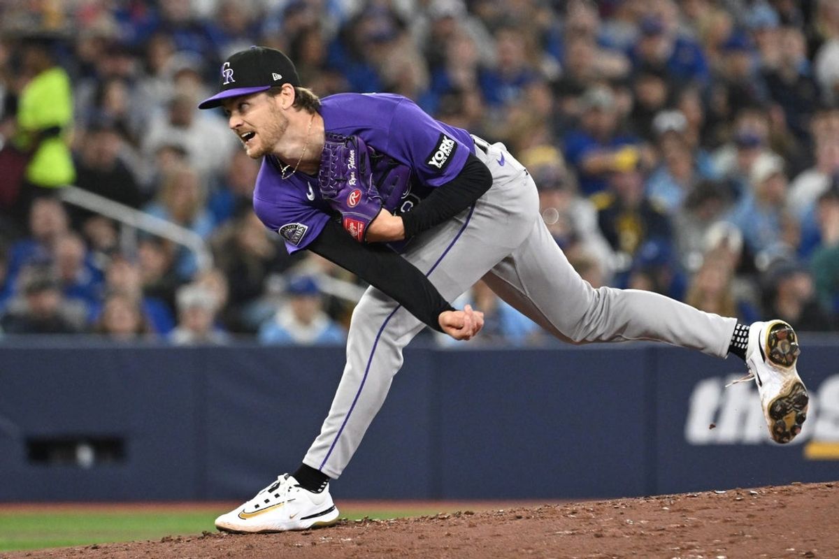 Mar 31, 2026; Toronto, Ontario, CAN;  Colorado Rockies starting pitcher Ryan Feltner (18) delivers a pitch against the Toronto Blue Jays in the third inning at Rogers Centre. Mandatory Credit: Dan Hamilton-Imagn Images