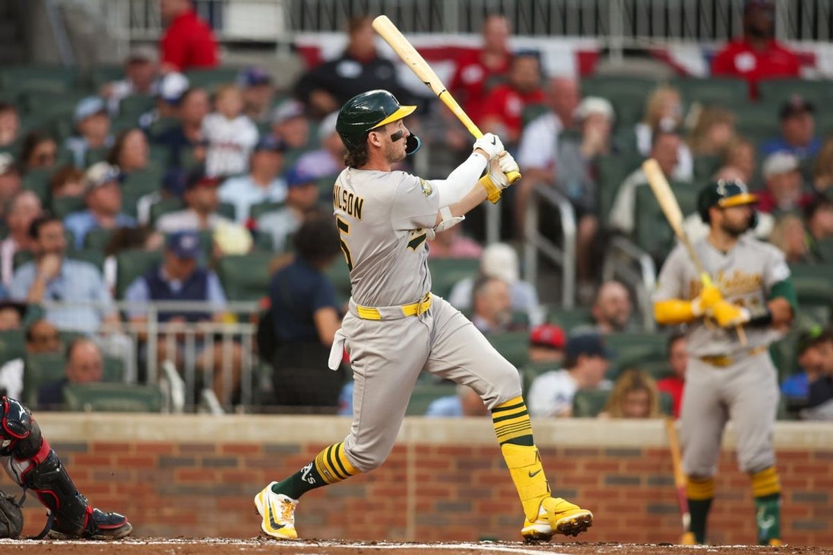 Mar 31, 2026; Atlanta, Georgia, USA; Athletics shortstop Jacob Wilson (5) hits a two-run ground rule double against the Atlanta Braves in the second inning at Truist Park. Mandatory Credit: Brett Davis-Imagn Images