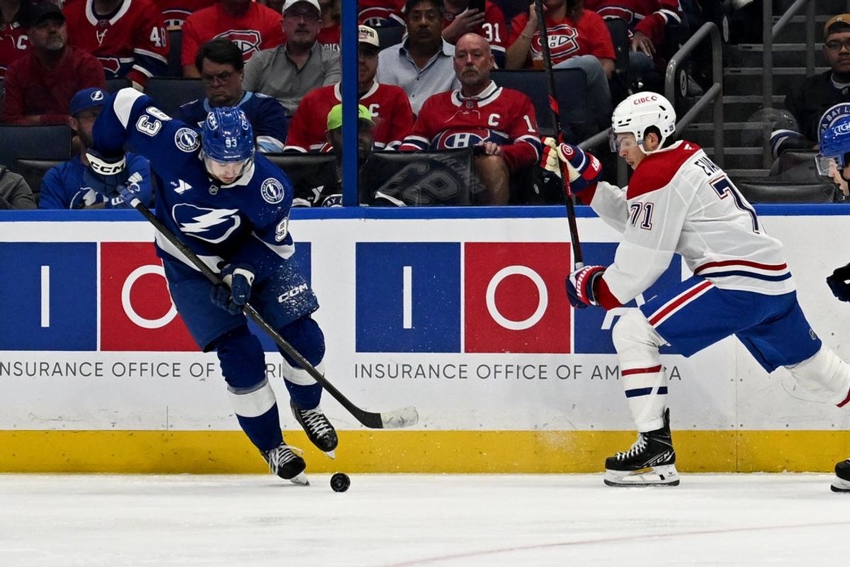 Mar 31, 2026; Tampa, Florida, USA; Tampa Bay Lightning center Gage Goncalves (93) attempts to get past Montreal Canadian center Jake Evans (71) in the second period  at Benchmark International Arena. Mandatory Credit: Jonathan Dyer-Imagn Images
