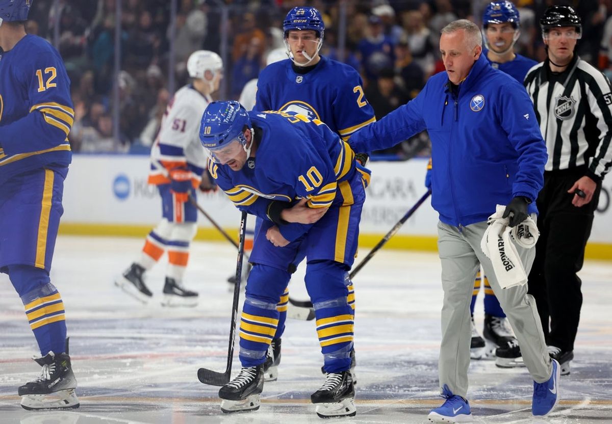 Mar 31, 2026; Buffalo, New York, USA;  Buffalo Sabres center Sam Carrick (10) goes off the ice with an injury during the third period against the New York Islanders at KeyBank Center. Mandatory Credit: Timothy T. Ludwig-Imagn Images