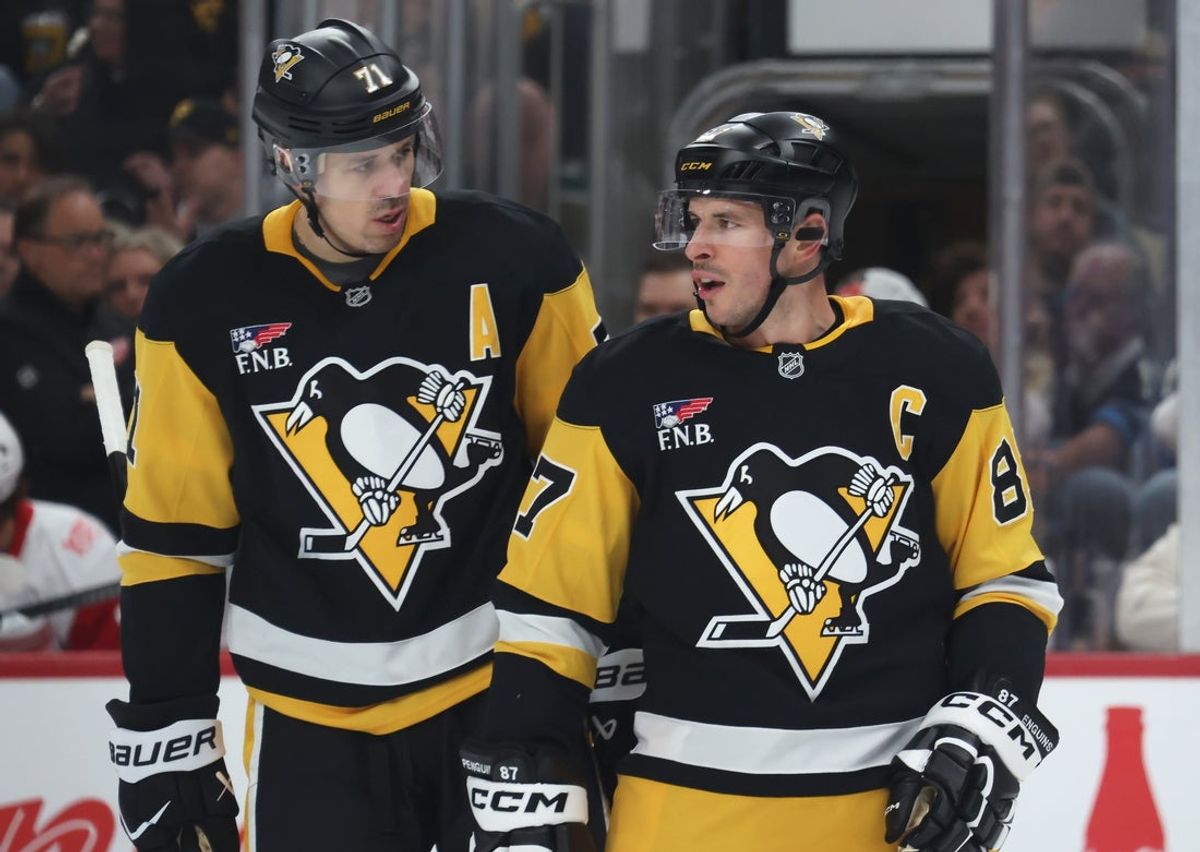 Mar 31, 2026; Pittsburgh, Pennsylvania, USA;  Pittsburgh Penguins center Evgeni Malkin (71) and center Sidney Crosby (87) talk on the ice against the Detroit Red Wings during the first period at PPG Paints Arena. Mandatory Credit: Charles LeClaire-Imagn Images