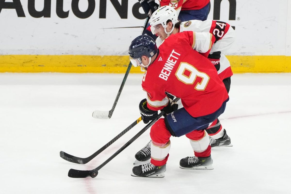 Mar 31, 2026; Sunrise, Florida, USA;  Florida Panthers center Sam Bennett (9) and Ottawa Senators center Dylan Cozens (24) battle for possession of the puck during the third period at Amerant Bank Arena. Mandatory Credit: Jim Rassol-Imagn Images