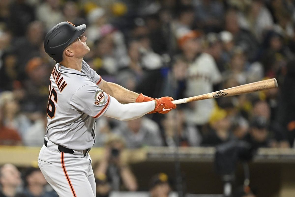 Mar 31, 2026; San Diego, California, USA; San Francisco Giants third baseman Matt Chapman (26) hits a solo home run during the third inning against the San Diego Padres at Petco Park. Mandatory Credit: Denis Poroy-Imagn Images