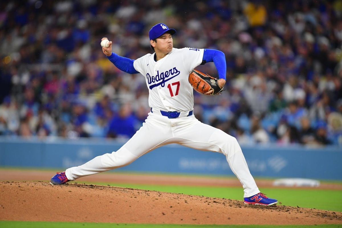 Mar 31, 2026; Los Angeles, California, USA; Los Angeles Dodgers two-way player Shohei Ohtani (17) throws to the plate during the third inning against the Cleveland Guardians at Dodger Stadium. Mandatory Credit: Gary A. Vasquez-Imagn Images