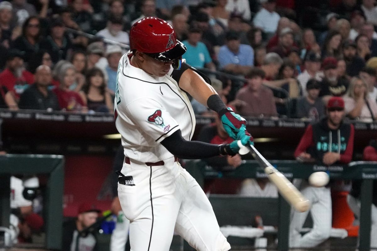 Mar 31, 2026; Phoenix, Arizona, USA; Arizona Diamondbacks third baseman Jose Fernandez hits a home run and first MLB HR against the Detroit Tigers in the fourth inning at Chase Field. Mandatory Credit: Rick Scuteri-Imagn Images