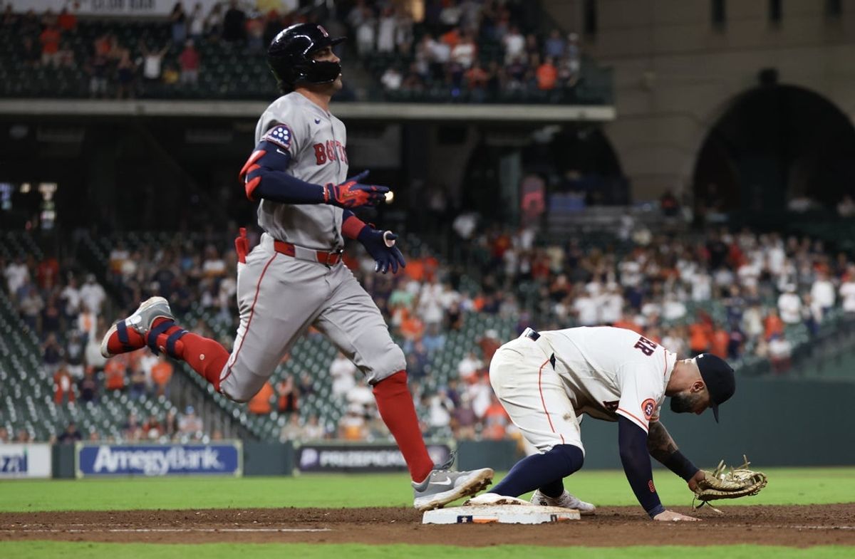 Mar 31, 2026; Houston, Texas, USA; Boston Red Sox second baseman Marcelo Mayer (11) is thrown out at first base as Houston Astros first baseman Christian Walker (8) makes the catch to end the game at Daikin Park. Mandatory Credit: Thomas Shea-Imagn Images