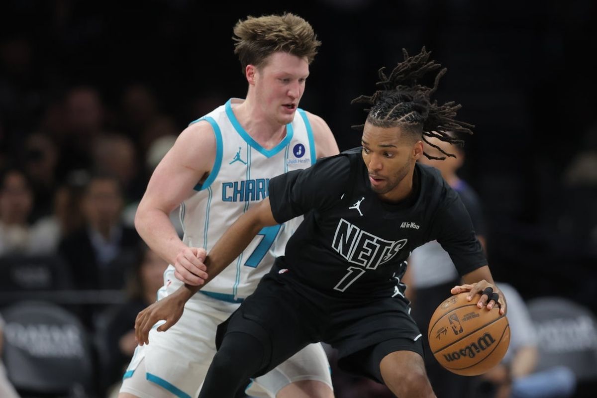 Mar 31, 2026; Brooklyn, New York, USA; Brooklyn Nets forward Ziaire Williams (1) controls the ball against Charlotte Hornets guard Kon Knueppel (7) during the third quarter at Barclays Center. Mandatory Credit: Brad Penner-Imagn Images