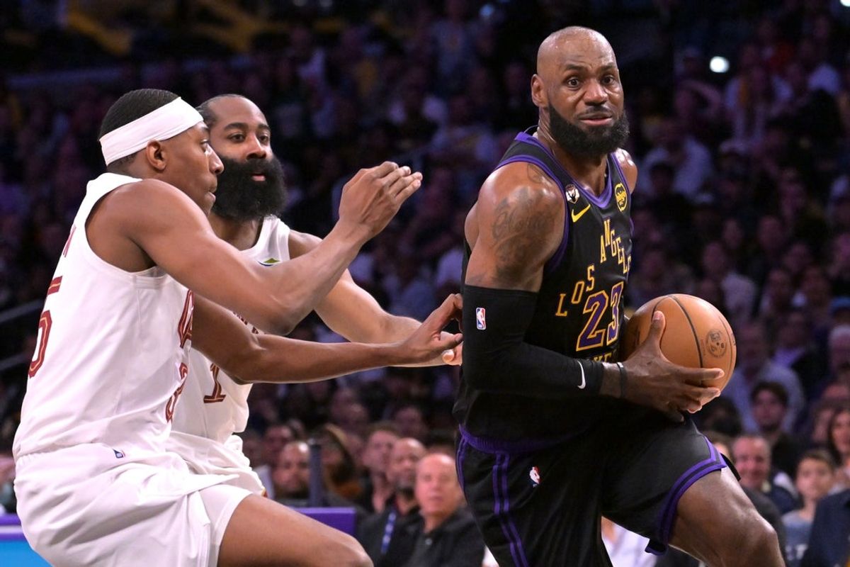 Mar 31, 2026; Los Angeles, California, USA;  Los Angeles Lakers forward LeBron James (23) is defended by Cleveland Cavaliers guard James Harden (1) and forward Nae'qwan Tomlin (35) in the first half at Crypto.com Arena. Mandatory Credit: Jayne Kamin-Oncea-Imagn Images