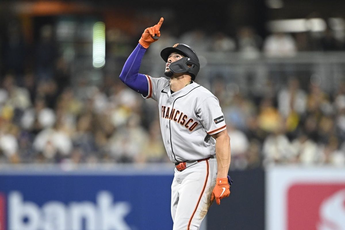 Mar 31, 2026; San Diego, California, USA; San Francisco Giants shortstop Willy Adames (2) points skyward after hitting a double during the eighth inning against the San Diego Padres at Petco Park. Mandatory Credit: Denis Poroy-Imagn Images