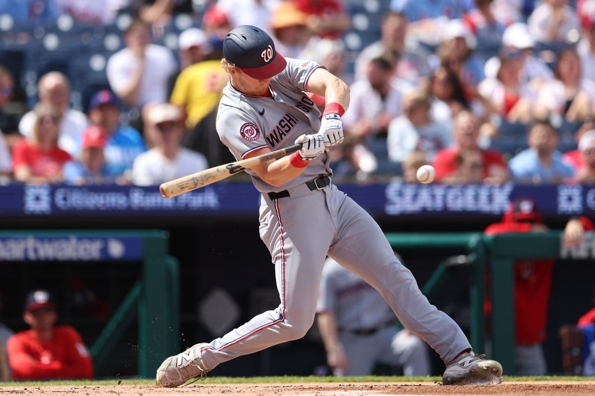 Apr 1, 2026; Philadelphia, Pennsylvania, USA; Washington Nationals left fielder Joey Wiemer (21) hits an infield single during the second inning against the Philadelphia Phillies at Citizens Bank Park. Mandatory Credit: Bill Streicher-Imagn Images