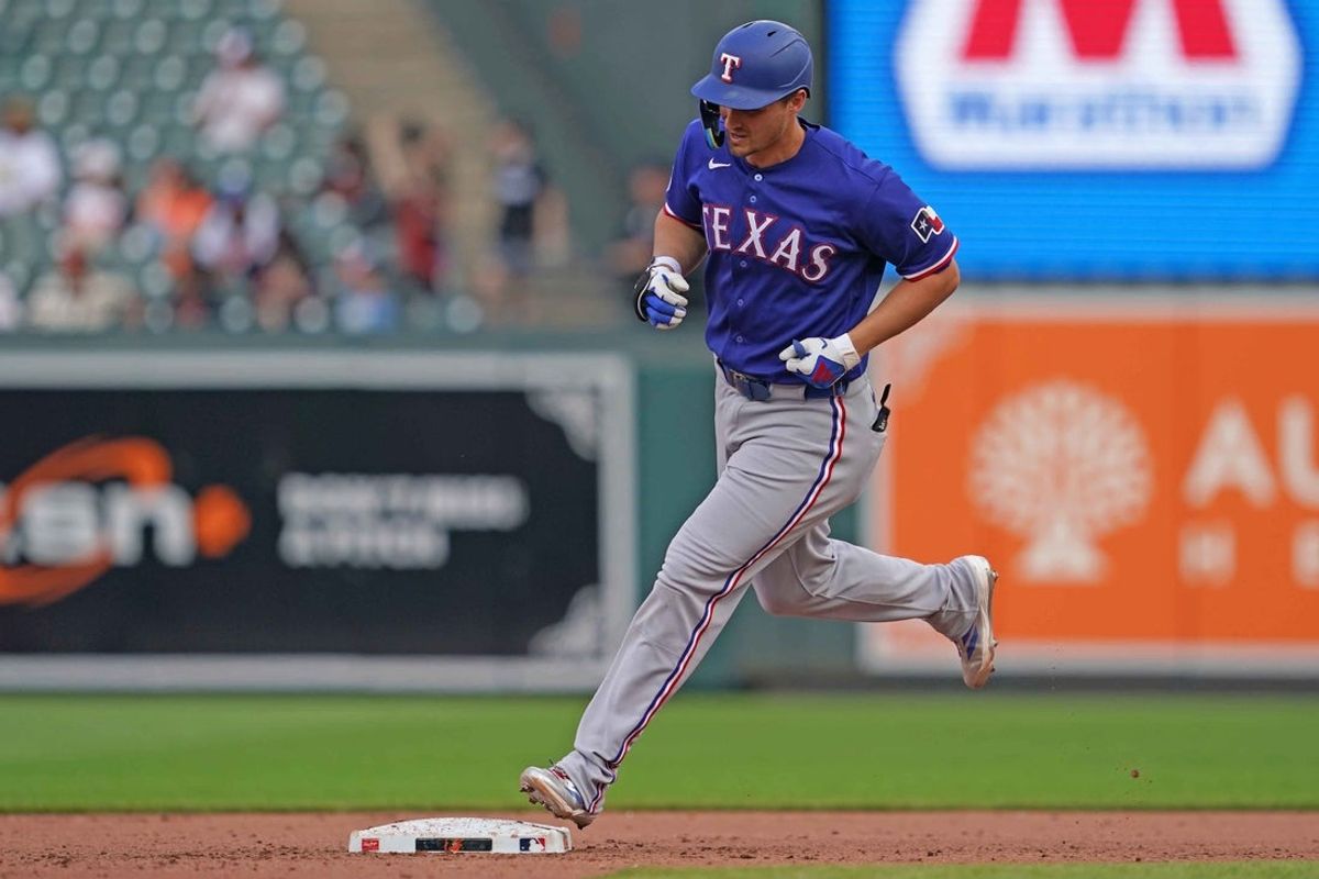 Apr 1, 2026; Baltimore, Maryland, USA; Texas Rangers shortstop Corey Seager (5) rounds the bases following his eighth inning solo home run against the Baltimore Orioles at Oriole Park at Camden Yards. Mandatory Credit: Mitch Stringer-Imagn Images