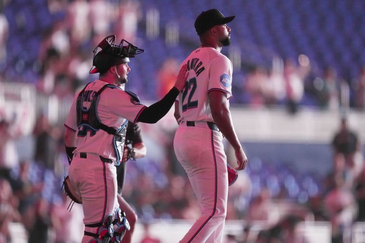 Apr 1, 2026; Miami, Florida, USA;  Miami Marlins starting pitcher Sandy Alcantara (22) reacts following his complete game shutout win over the Chicago White Sox by catcher Liam Hicks (34) at loanDepot Park. Mandatory Credit: Jim Rassol-Imagn Images