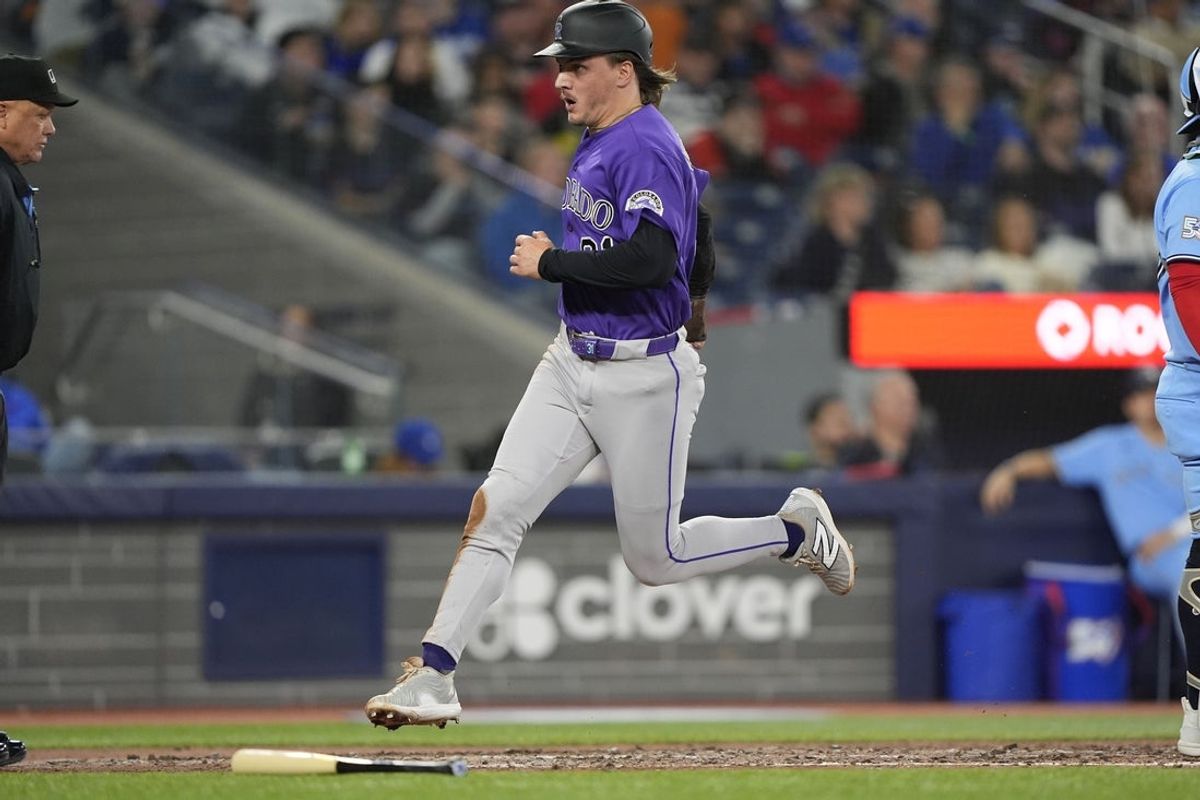 Apr 1, 2026; Toronto, Ontario, CAN; Colorado Rockies right fielder Jake McCarthy (31) scores on a single by Colorado Rockies right fielder Troy Johnston (not pictured) during the eighth inning against the Toronto Blue Jays at Rogers Centre. Mandatory Credit: John E. Sokolowski-Imagn Images