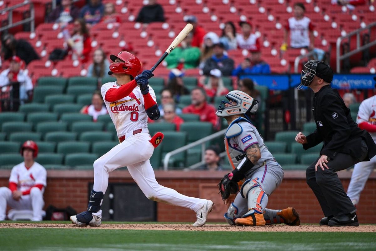 Apr 1, 2026; St. Louis, Missouri, USA; St. Louis Cardinals shortstop Masyn Winn (0) hits a walk-off one run single against the New York Mets during the eleventh inning at Busch Stadium. Mandatory Credit: Jeff Curry-Imagn Images