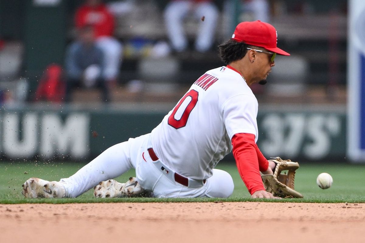 Apr 1, 2026; St. Louis, Missouri, USA; St. Louis Cardinals shortstop Masyn Winn (0) slides and fields a ground ball against the New York Mets during the eighth inning at Busch Stadium. Mandatory Credit: Jeff Curry-Imagn Images