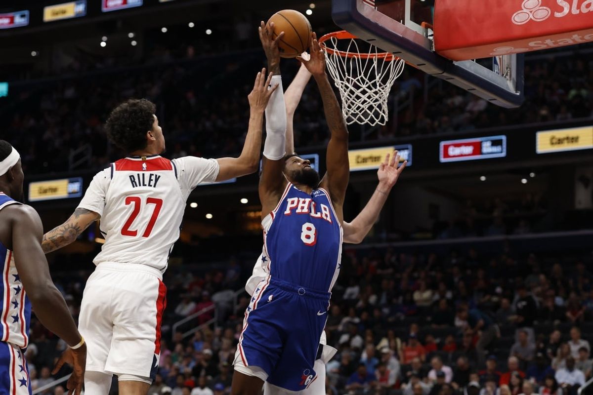 Apr 1, 2026; Washington, District of Columbia, USA; Philadelphia 76ers forward Paul George (8) shoots the ball as Washington Wizards guard Will Riley (27) defends in the first half at Capital One Arena. Mandatory Credit: Geoff Burke-Imagn Images