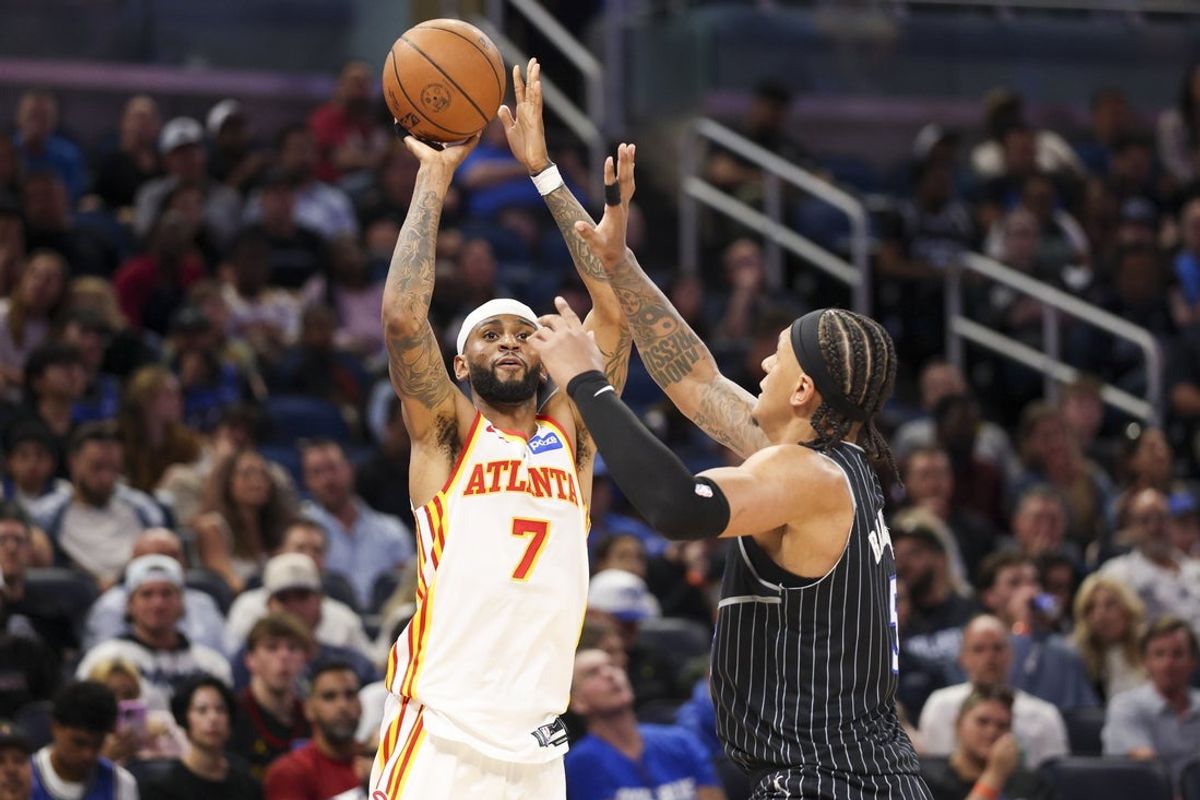 Apr 1, 2026; Orlando, Florida, USA; Atlanta Hawks guard Nickeil Alexander-Walker (7) shoots the ball over Orlando Magic forward Paolo Banchero (5) in the second quarter at Kia Center. Mandatory Credit: Nathan Ray Seebeck-Imagn Images