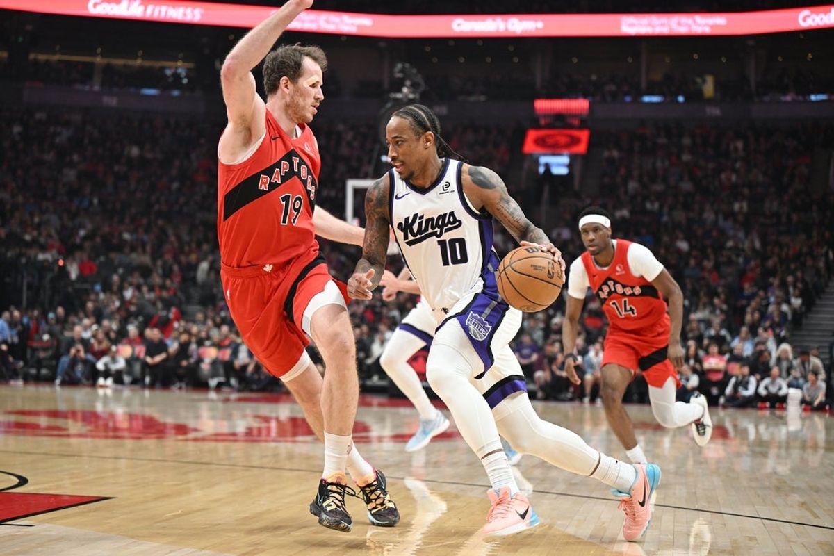 Apr 1, 2026; Toronto, Ontario, CAN; Sacramento Kings guard DeMar DeRozan (10) dribbles the ball against Toronto Raptors center Jakob Poeltl (19) in the first half at Scotiabank Arena. Mandatory Credit: Dan Hamilton-Imagn Images