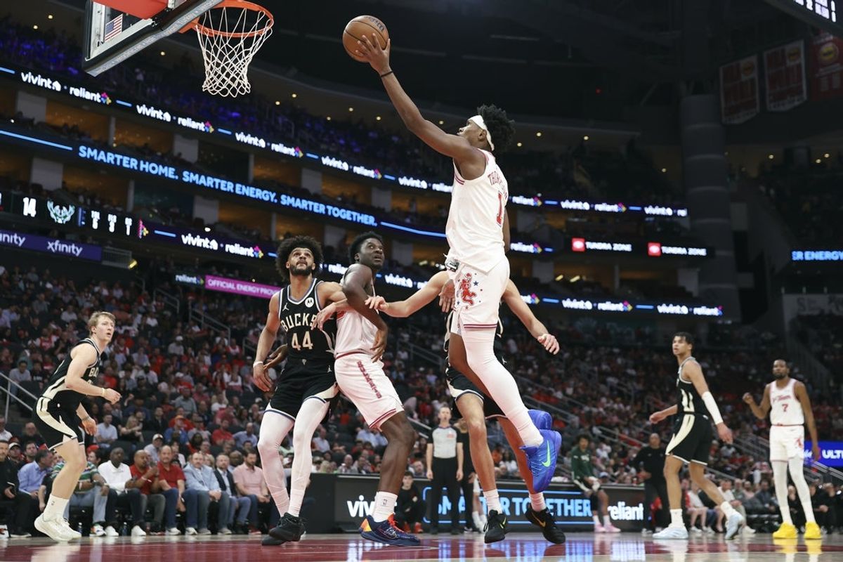 Apr 1, 2026; Houston, Texas, USA; Houston Rockets guard/forward Amen Thompson (1) shoots the ball during the first quarter against the Milwaukee Bucks at Toyota Center. Mandatory Credit: Troy Taormina-Imagn Images