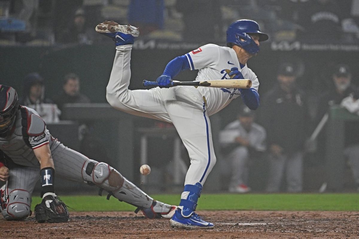 Apr 1, 2026; Kansas City, Missouri, USA;  Kansas City Royals left fielder Isaac Collins (1) reacts after getting hit with a pitch in the fourth inning against the Minnesota Twins at Kauffman Stadium. Mandatory Credit: Peter Aiken-Imagn Images