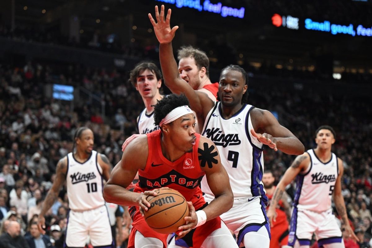 Apr 1, 2026; Toronto, Ontario, CAN;  Toronto Raptors forward Scottie Barnes (4) looks for a way past Sacramento Kings forward Precious Achiuwa (9) in the second half at Scotiabank Arena. Mandatory Credit: Dan Hamilton-Imagn Images
