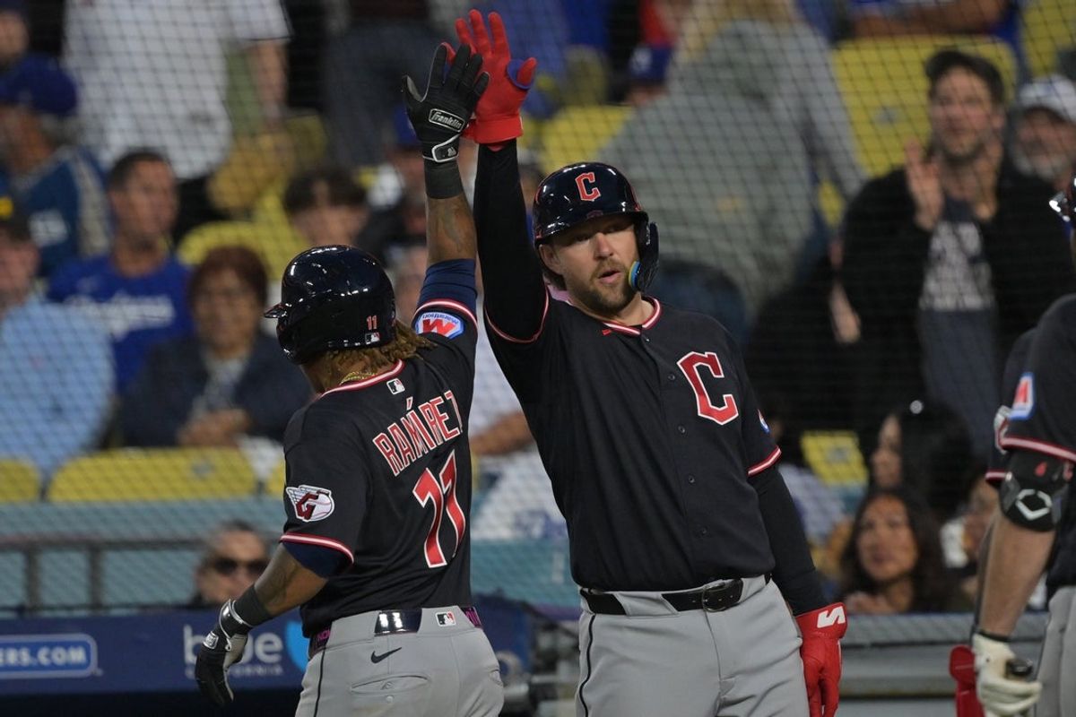 Apr 1, 2026; Los Angeles, California, USA;  Cleveland Guardians third baseman Jose Ramirez (11) is greeted at the dugout after hitting a two-run home run in the eighth inning against the Los Angeles Dodgers at Dodger Stadium. Mandatory Credit: Jayne Kamin-Oncea-Imagn Images