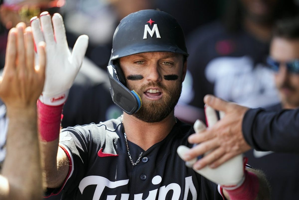 Apr 2, 2026; Kansas City, Missouri, USA; Minnesota Twins second baseman Kody Clemens (2) is congratulated by teammates after scoring a run during the second inning against the Kansas City Royals at Kauffman Stadium. Mandatory Credit: Jay Biggerstaff-Imagn Images