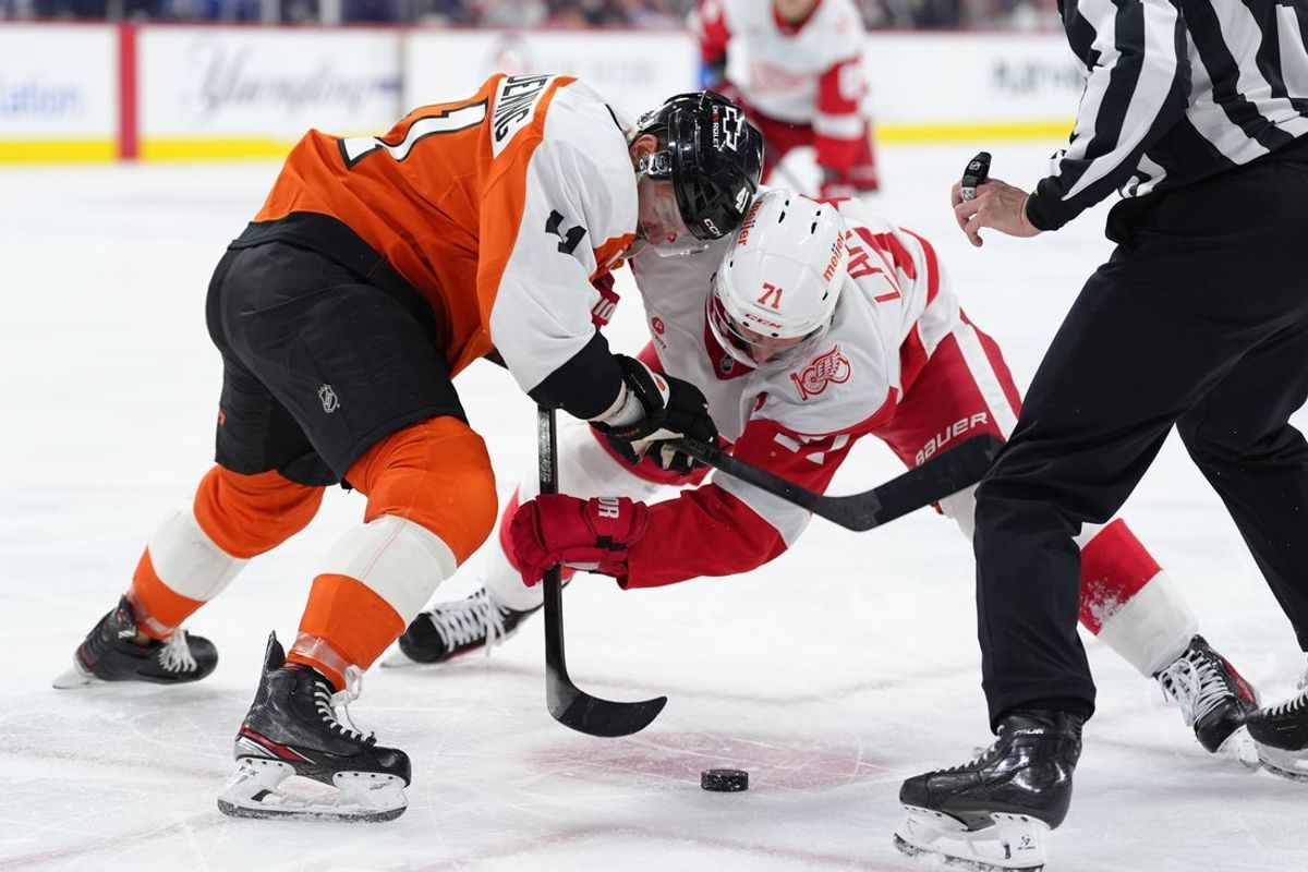 Apr 2, 2026; Philadelphia, Pennsylvania, USA; Philadelphia Flyers center Luke Glendening (41) and Detroit Red Wings center Dylan Larkin (71) battle for a faceoff in the first period at Xfinity Mobile Arena. Mandatory Credit: Kyle Ross-Imagn Images