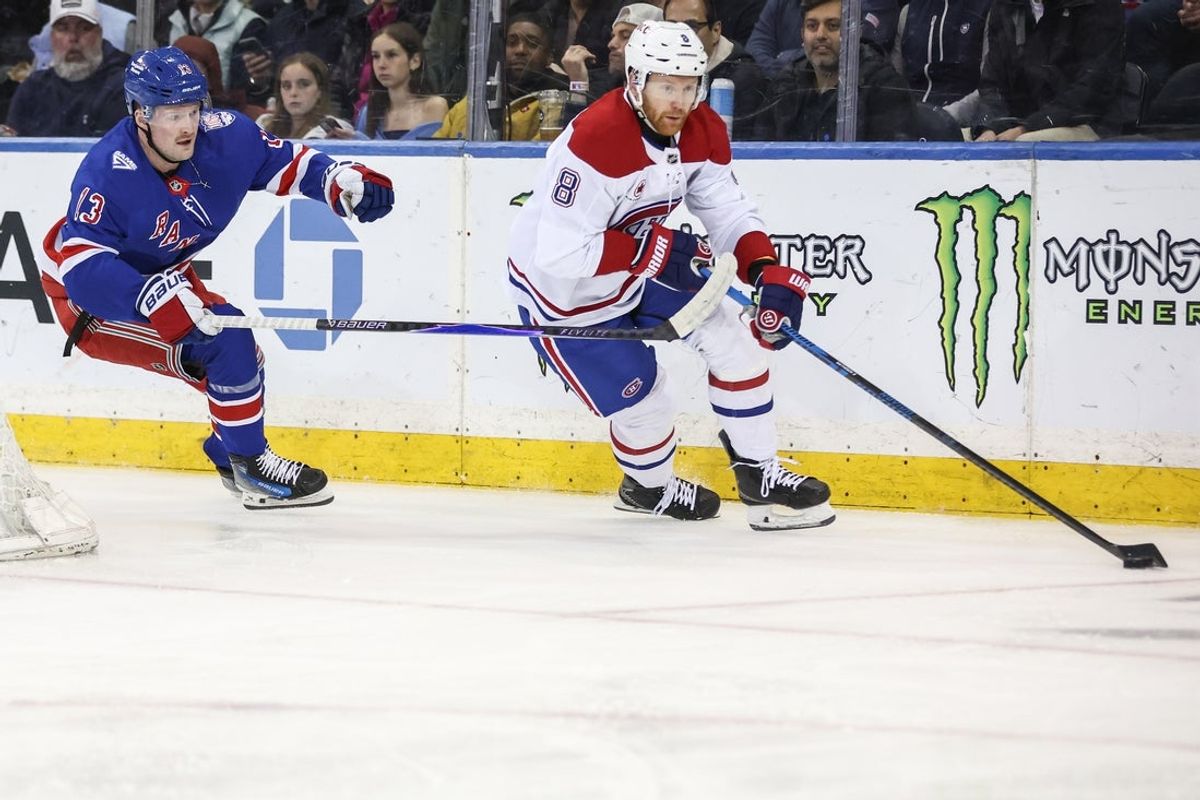 Apr 2, 2026; New York, New York, USA;  Montréal Canadiens defenseman Mike Matheson (8) and New York Rangers left wing Alexis Lafrenière (13) chase the puck in the first period at Madison Square Garden. Mandatory Credit: Wendell Cruz-Imagn Images