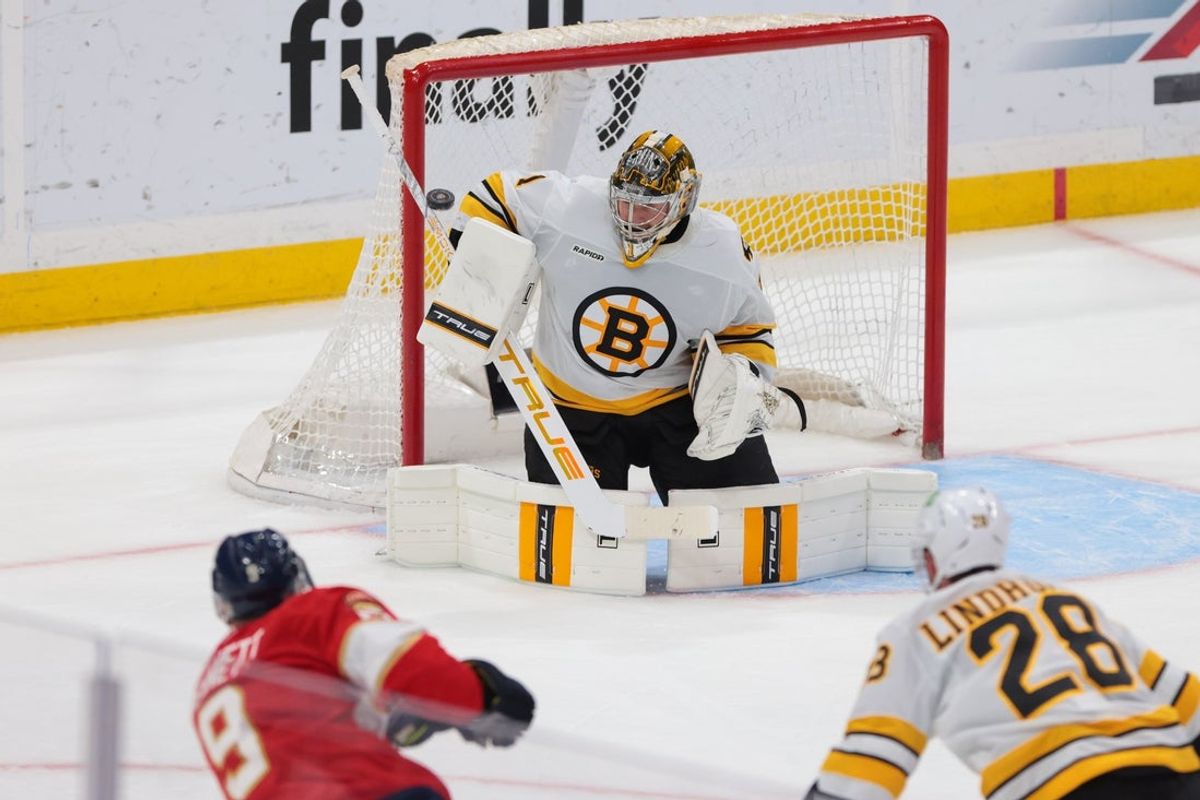 Apr 2, 2026; Sunrise, Florida, USA; Boston Bruins goaltender Jeremy Swayman (1) makes a save against Florida Panthers center Sam Bennett (9) during the third period at Amerant Bank Arena. Mandatory Credit: Sam Navarro-Imagn Images