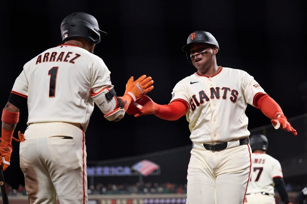 Apr 2, 2026; San Francisco, California, USA; San Francisco Giants designated hitter Rafael Devers (16) celebrates with infielder Luis Arraez (1) after hitting a one run home run against the New York Mets during the sixth inning at Oracle Park. Mandatory Credit: Robert Edwards-Imagn Images