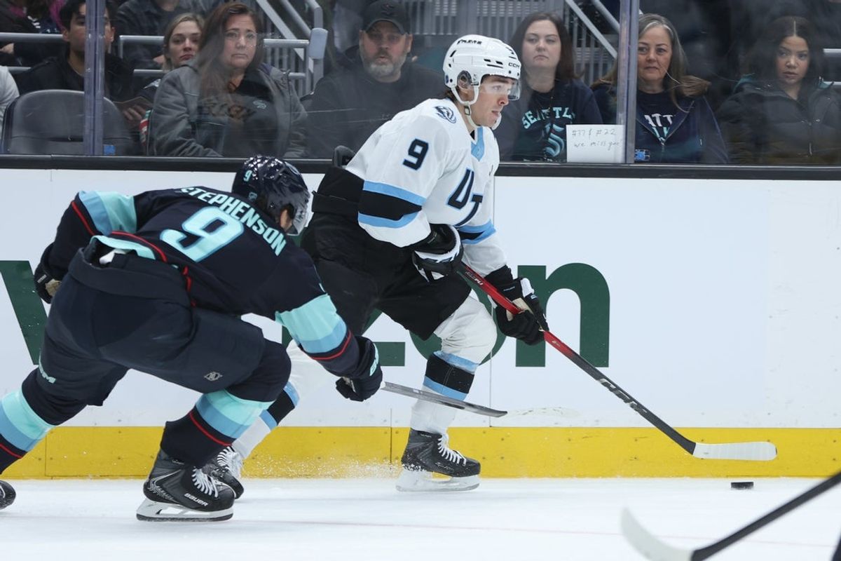 Apr 2, 2026; Seattle, Washington, USA; Utah Mammoth right wing Clayton Keller (9) looks to pass while defended by Seattle Kraken center Chandler Stephenson (9) in the second period at Climate Pledge Arena. Mandatory Credit: Kevin Ng-Imagn Images