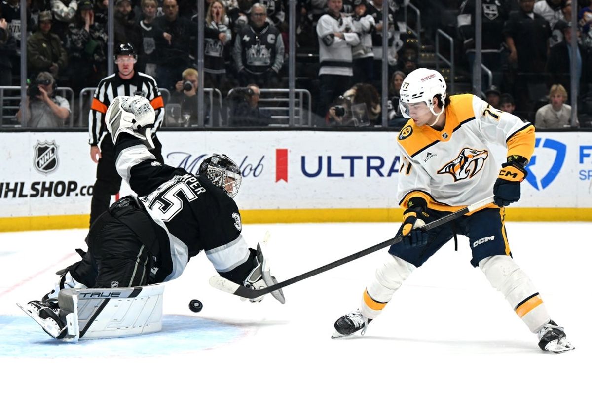Apr 2, 2026; Los Angeles, California, USA; Nashville Predators right wing Luke Evangelista (77) scores the game winning goal during a penalty shootout against Los Angeles Kings goaltender Darcy Kuemper (35) at Crypto.com Arena. Mandatory Credit: Griffin Hooper-Imagn Images