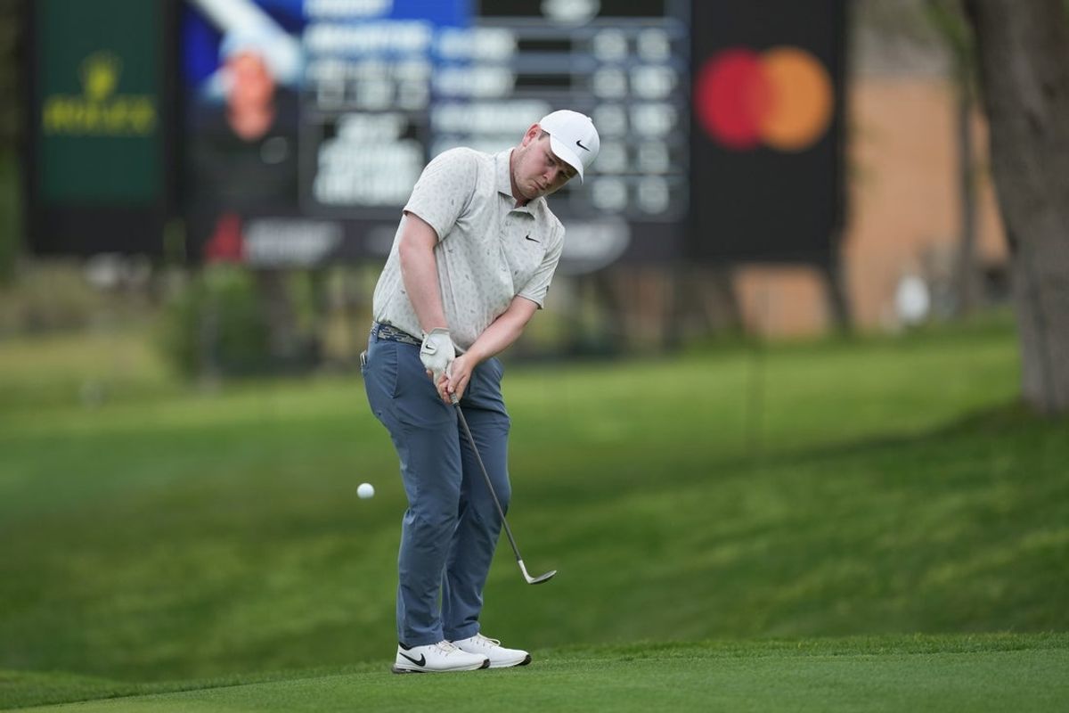 Apr 3, 2026; San Antonio, Texas, USA; Robert MacIntyre chips onto the 18th green during the second round of the Valero Texas Open golf tournament. Mandatory Credit: Daniel Dunn-Imagn Images