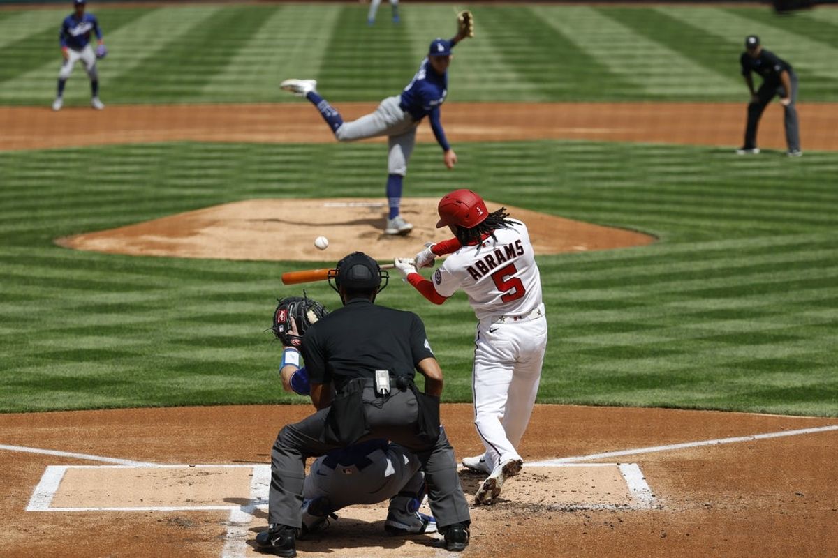 Apr 3, 2026; Washington, District of Columbia, USA; Washington Nationals shortstop CJ Abrams (5) hits a three run home run against the Los Angeles Dodgers during the first inning at Nationals Park. Mandatory Credit: Geoff Burke-Imagn Images